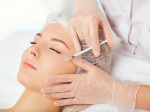 woman getting mesotherapy injections around the eyes