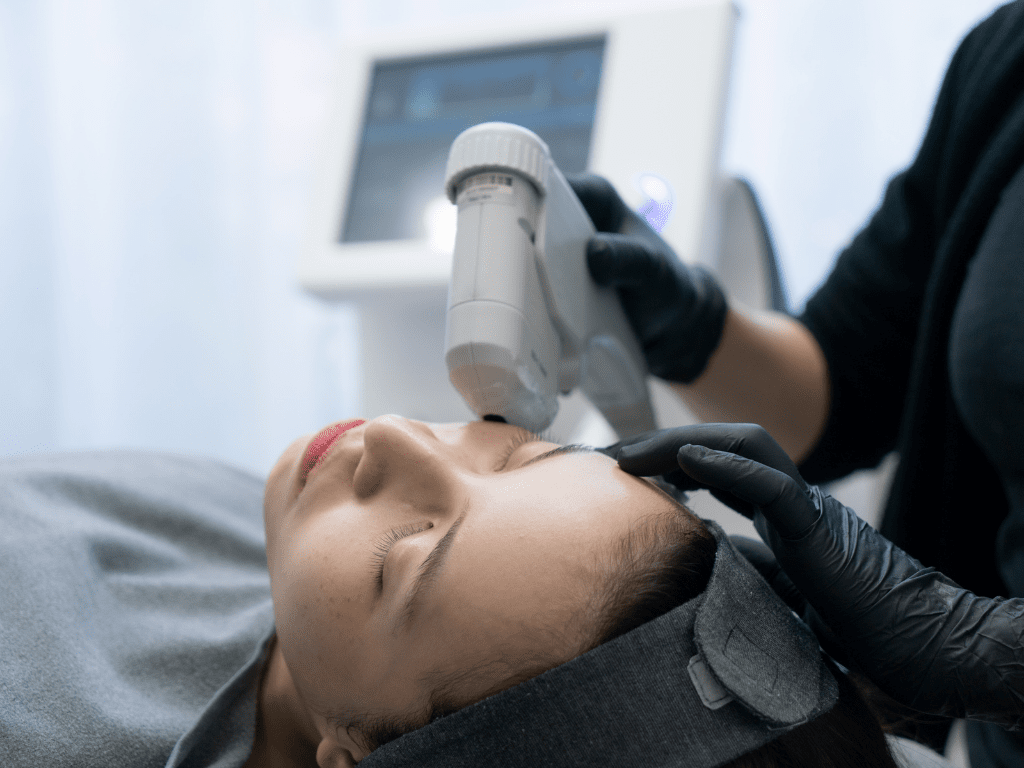 woman getting hifu treatment by a specialized skincare expert